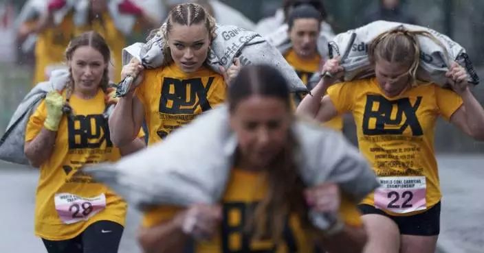 AP PHOTOS: Contestants haul heavy sacks of coal in unusual Yorkshire tradition