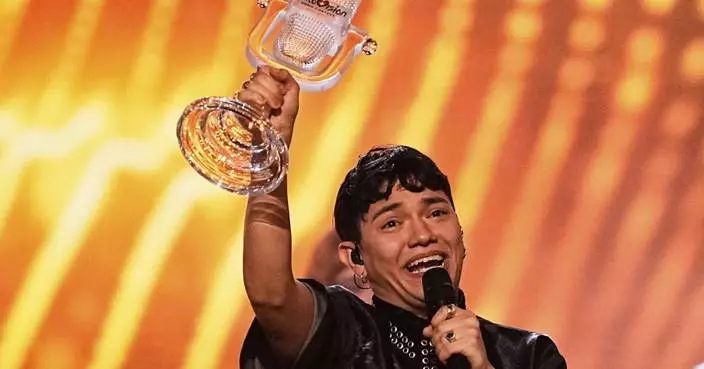 Austria welcomes JJ back home with cheers, hugs and roses after winning Eurovision Song Contest