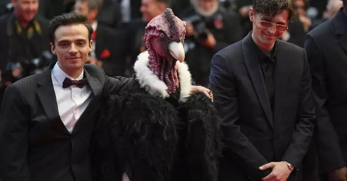Bird man on red carpet leaves Cannes squawking