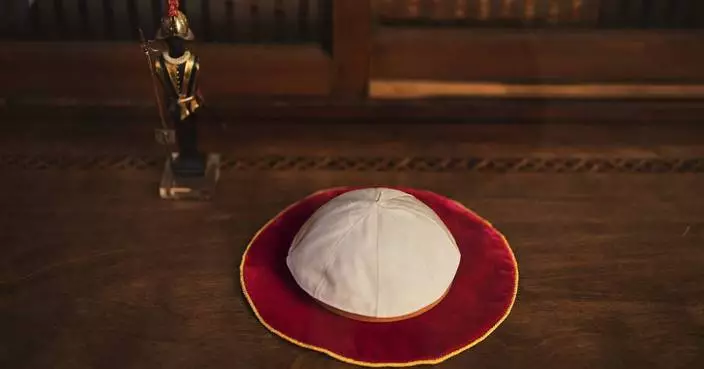 These papal tailors aren't expecting a traditional order for new cassocks to outfit the next pope