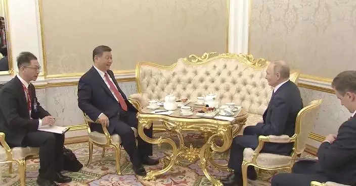 Xi, Putin have tea chat in Moscow