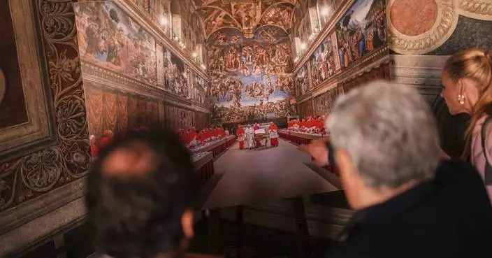 Vatican workers install Sistine Chapel stove where ballots are burned during conclave to elect pope