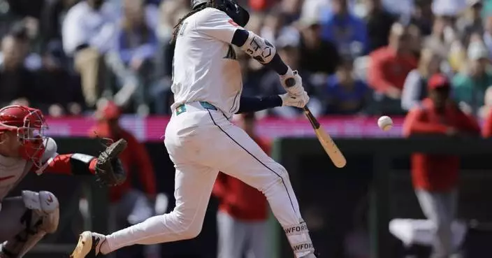 Surging Mariners beat Angels 9-3; Trout leaves game early with sore knee