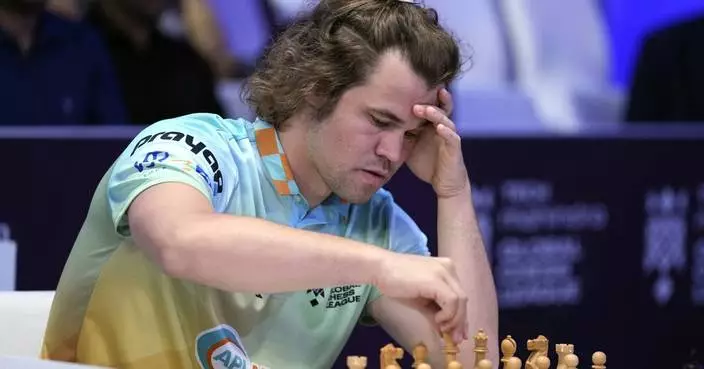 Chess grandmaster Magnus Carlsen faces showdown against &#8216;the world.&#8217; Will it end in a draw?