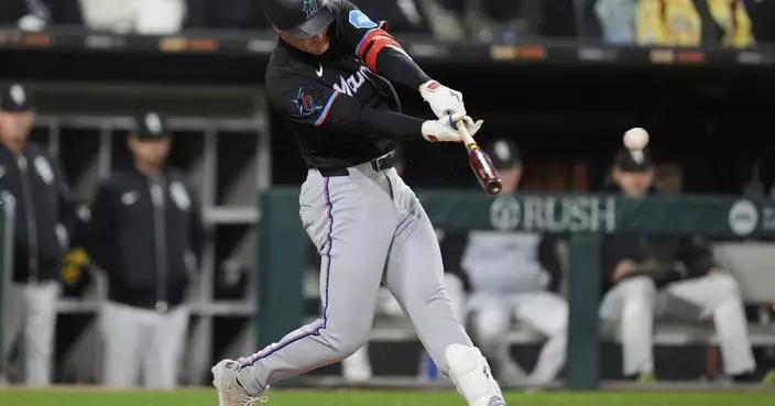 Wagaman breaks tie in 8th with 2-run triple to lift Marlins over White Sox 3-1