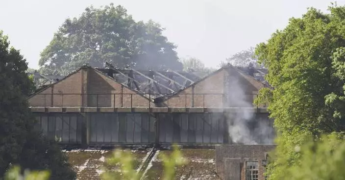 Fire at a former UK military base kills 2 firefighters and a civilian