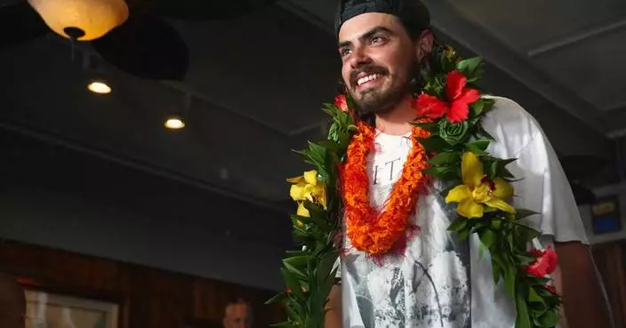 An Oregon man who quit his job to set sail with his cat arrives to cheering fans in Hawaii