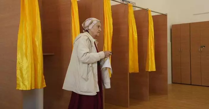 Romanians vote in a presidential redo after voided election sparked deep political crisis