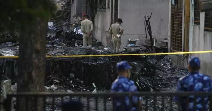 Authorities investigate one of India’s worst aviation disasters as Modi visits the site