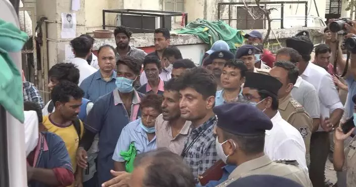 Grieving relatives crowd hospital for DNA identification after fatal India plane crash