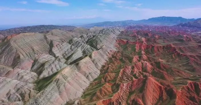 Danxia landform in Xinjiang presents stunning view after rain