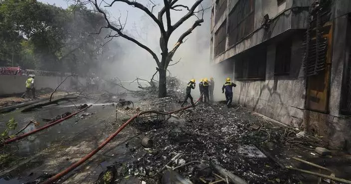 AP PHOTOS: Air India plane crashes with hundreds of passengers onboard