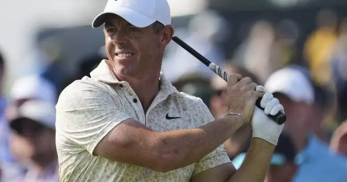 A frustrated McIlroy smashes a US Open tee marker but makes it to the weekend anyway