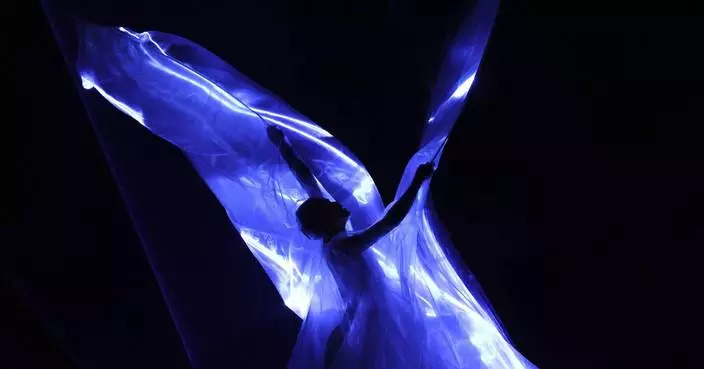 Iris Van Herpen unveils &#8216;living&#8217; couture dress of bioluminescent algae in Paris