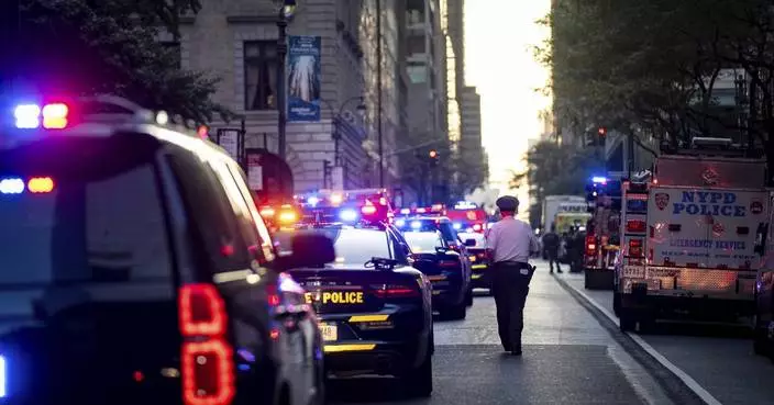At least 2 people shot at Manhattan office building housing financial firms and NFL, source tells AP