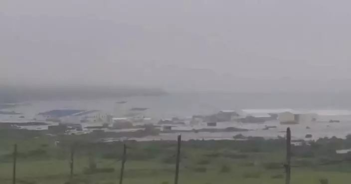 The Latest: Tsunami warnings lifted in most places