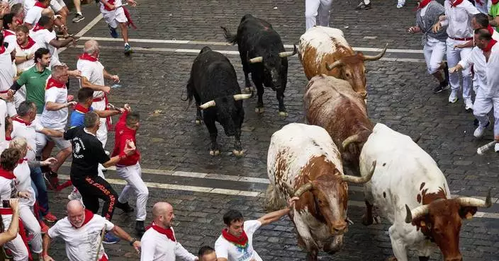 Daredevils run with charging bulls at Pamplona&#8217;s famous San Fermín festival