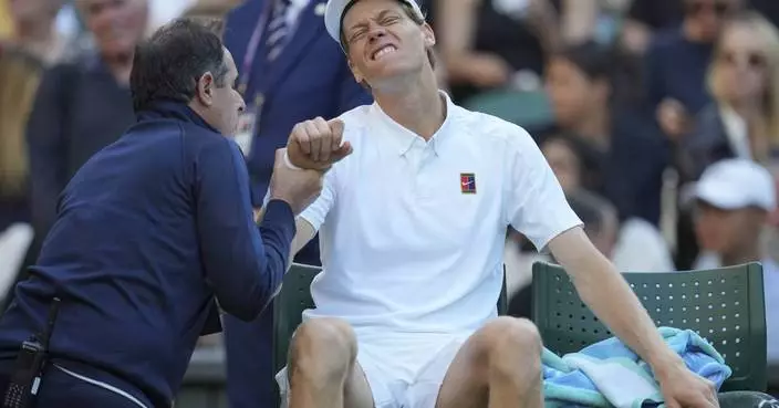 Jannik Sinner reaches the Wimbledon quarterfinals despite a bad elbow when an injured Dimitrov stops