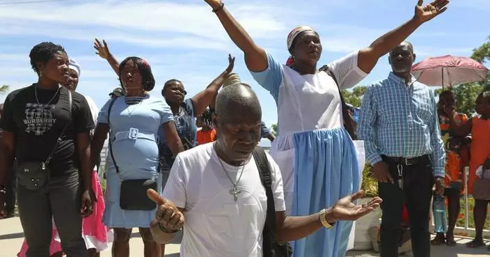Thousands of Haitians mark annual pilgrimage far from a sacred waterfall surrounded by gangs
