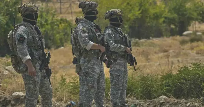 Kurdish separatist fighters in Iraq begin laying down weapons as part of peace process with Turkey