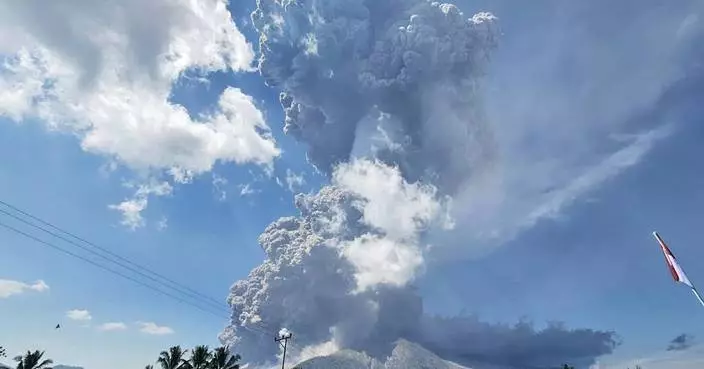 An eruption of Indonesia&#8217;s Mount Lewotobi Laki Laki volcano sends ash 11 miles high