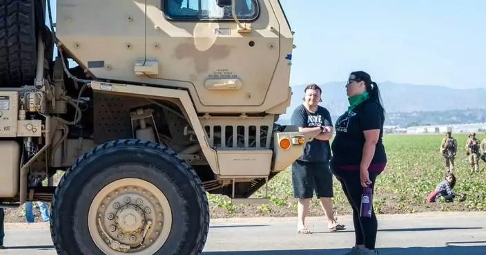 Authorities say about 200 immigrants were arrested in raids on 2 Southern California farms