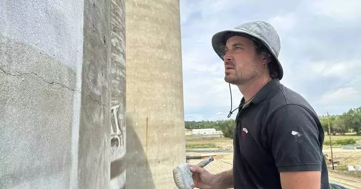 An Australian artist is creating a massive mural in the middle of a small North Dakota town