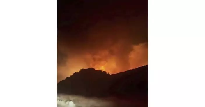 Firefighters make progress against fast-moving blaze along highway north of Los Angeles