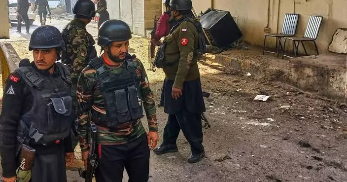 Suicide bombers strike security force headquarters in northwestern Pakistan, killing 3 officers