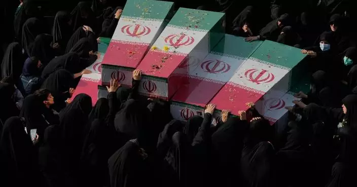 Photos show mourners in Tehran honoring the unknown soldiers killed in the 1980’s Iran-Iraq war