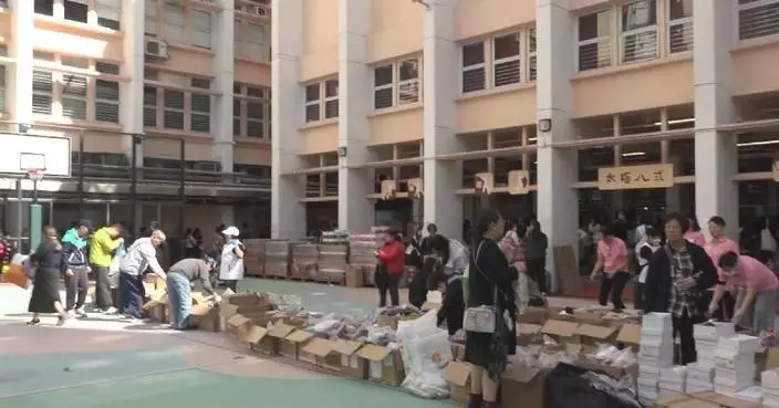 Residents across Hong Kong rush to help after deadly fire