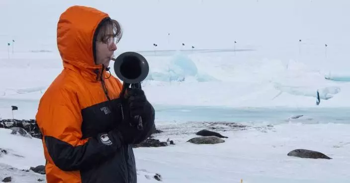 On the world’s coldest stage, a military musician plays with a plastic horn and double gloves