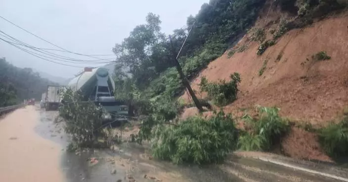 Landslide strikes bus on mountain pass in Vietnam, killing 6, as heavy rain persists