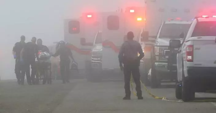 Emergency officials respond to a small plane crash near Galveston, Texas