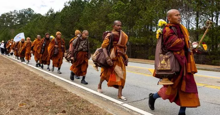Buddhist monks persist in peace walk despite injuries as thousands follow them on social media