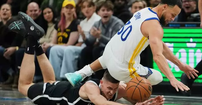 Curry, Butler lead the Warriors to a 120-107 victory over the Nets