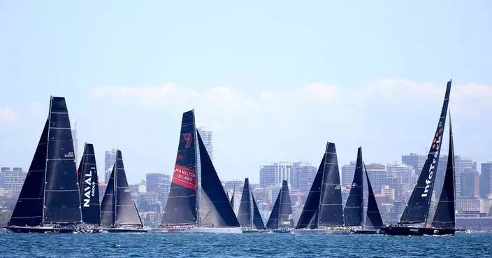 Defending champion LawConnect leads yachts out of Sydney harbor in annual ocean race to Hobart