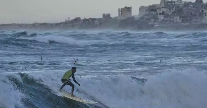 Photos show surfers riding waves along Gaza City’s damaged coastline