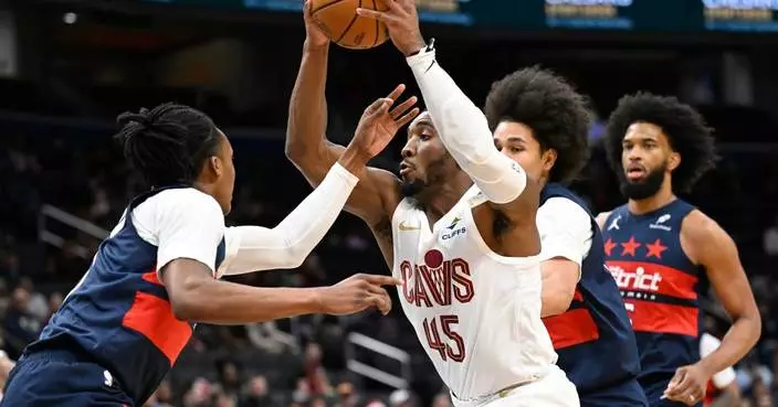 Mitchell scores 24 of his 48 points in the 4th quarter to rally Cavaliers past Wizards 130-126