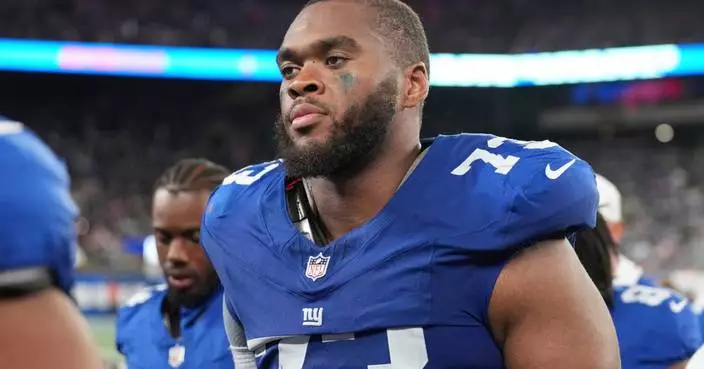 Evan Neal practices with the Giants. He’s still not sure he’ll play for them again