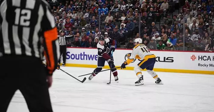 MacKinnon has goal and assist as Avalanche beat Predators 4-2 for 11th straight home win