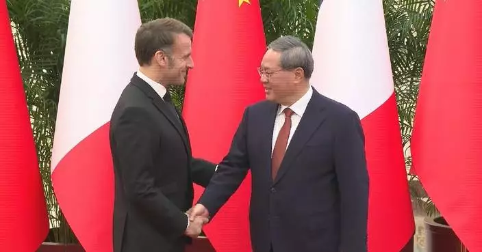 Chinese premier meets visiting French president