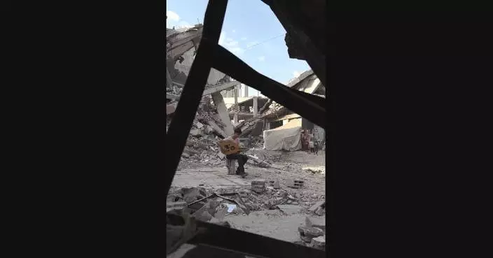 Gaza musician bravely keeps on playing to deliver sounds of joy amid devastation