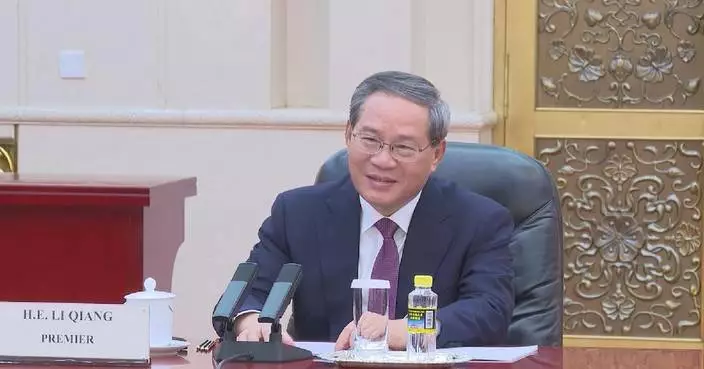 China to continue opening up its mega-market: premier