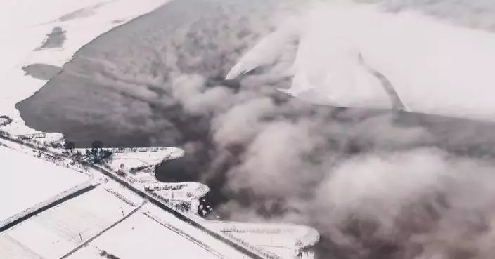 Frost smoke cloaks Yellow River after first snowfall in Shandong