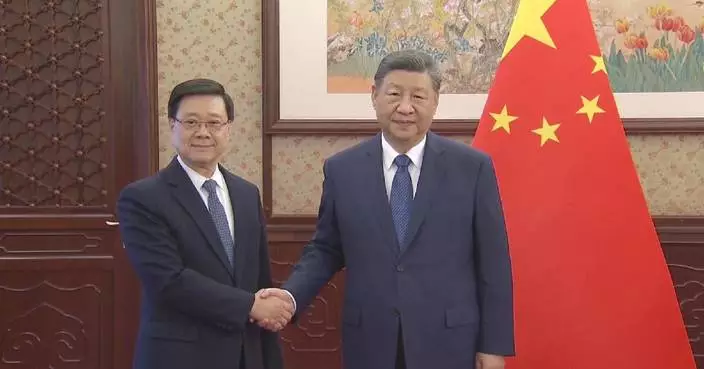 Xi hears report from HKSAR chief executive