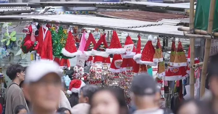 Hong Kong’s shopping districts buzz with holiday spirit