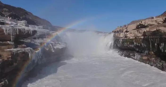 Hukou Waterfall shines with ice, rainbow, clear cascades