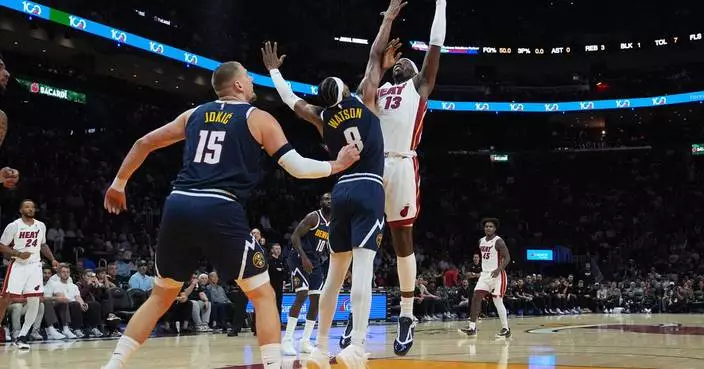 Nuggets star Nikola Jokic hurts left knee, limps off court at halftime in Miami