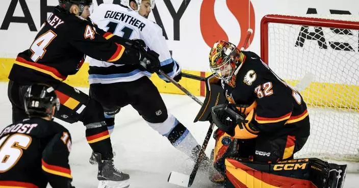 Wolf has 28 saves for 5th career shutout as Flames beat Mammoth 2-0